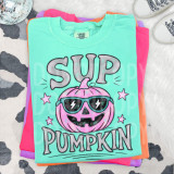 Sup Pumpkin Pink DTF Heat Transfer, colorful t-shirt with a pink pumpkin wearing sunglasses and the words 'SUP PUMPKIN' printed on it.