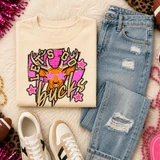 Pink Glitter Mascot - 62 teams - DTF Heat Transfer, a colorful graphic design featuring a deer with antlers, pink stars, and the word 'bucks' on a beige sweatshirt.