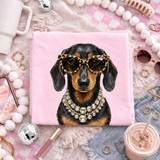 Glam Tan/Black Dachshund DTF Heat Transfer, a creative fabric print featuring a stylish black and tan dachshund dog wearing leopard print glasses and a diamond necklace, designed for customizing apparel.