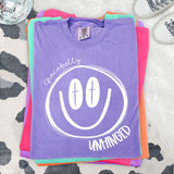 Gracefully Unhinged DTF Heat Transfer, vibrant purple T-shirt with a white smiley face and playful text design.