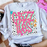 Retro Lotty Dotty School Mascot DTF Heat Transfer, colorful vibrant design on a light gray sweatshirt laying on a beige and white textured surface.