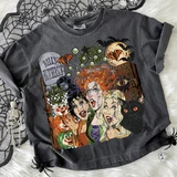 Vintage Halloween Witches DTF Heat Transfer, Halloween-themed graphic on a dark gray T-shirt featuring cartoon witches, bats, a black cat, and a full moon.