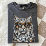 Glam Wildcat DTF Transfer, a detailed illustrated graphic of a wildcat wearing leopard print glasses and a statement necklace, on a folded gray sweatshirt.