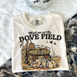 Meet Me at the Dove Field DTF Heat Transfer, mounted on a white T-shirt featuring a hunting-themed graphic with a tote, ducks, and text.