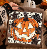 Jack O Lantern Pumpkin DTF Heat Transfer, Halloween-themed pumpkin design with stars and leaves on fabric.