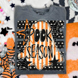 Spooky Season Ghost DTF Heat Transfer, Halloween-themed ghost and pumpkin artwork on a gray T-shirt.