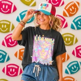 Neon Star Mascot DTF Transfers | School Spirit Mascot Collection, vibrant holographic lion mascot design with star glasses on a woman's black t-shirt, surrounded by colorful football-shaped smiley face decorations.