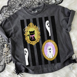 Spooky Black Cat & Ghost Frames DTF Heat Transfer, Halloween-themed design on a black t-shirt with ghost and cat illustrations in decorative frames.