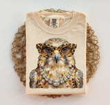 Glam Falcon DTF Heat Transfer, detailed image of a t-shirt featuring a falcon wearing glasses and a pearl necklace.