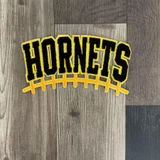 Hornets Black and Yellow Chenille Football Laces Patch, decorative sports patch featuring the word 'Hornets' in black and yellow chenille, with a football lace design in yellow underneath.