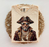 Glam Pirate DTF Heat Transfer, detailed pirate graphic design on a folded beige T-shirt.