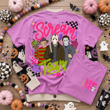 Scream Team Halloween DTF Transfer Set, pink T-shirt with Halloween-themed graphic featuring characters from the horror movie franchise, surrounded by Halloween decorations and confetti.