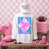 Loud & Proud Mascot DTF Transfers | Retro School Spirit Mascot Collection, vibrant graphic design with a glowing pink unicorn mascot and colorful text on a white sweatshirt, surrounded by pink-themed sports and party accessories.