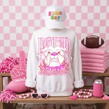 Loud & Proud Mascot DTF Transfers | Retro School Spirit Mascot Collection, white sweatshirt with a colorful animated mascot design and text, displayed on a mannequin with a white cap and pink-themed sports accessories and decorations.