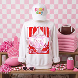 Loud & Proud Mascot DTF Transfers | Retro School Spirit Mascot Collection, white sweatshirt with a bold graphic of an elephant mascot and the text "LOUD" and "all Proud" in colorful and stylish fonts, displayed with sports-themed decorations in a pink-themed setting.