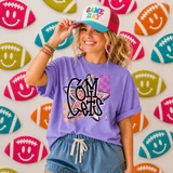 Comets mascot DTF transfer with retro star graphic in pink and orange checkered pattern on purple shirt