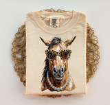 Glam Mustang Horse DTF Heat Transfer | Western Horse DTF, beige t-shirt showcasing a stylish illustrated horse wearing sunglasses and a pearl necklace.