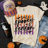 Spooky Season DTF Transfer, Retro Striped Halloween Design on a T-shirt featuring orange, purple, and black vertical stripes with bats, stars, and the text 'spooky season' in black cursive style.
