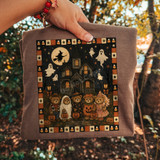 Vintage Halloween DTF transfer with trick-or-treating teddy bears in costume, a haunted house, witch on a broomstick, ghosts, and a candy corn border