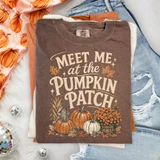 Meet Me at the Pumpkin Patch DTF transfer with retro lettering, autumn leaves, corn stalks, pumpkins, and mums on an espresso brown shirt