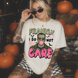 Frankly I Do Not Care Halloween DTF transfer with Frankenstein wearing pink heart glasses and blowing bubblegum, surrounded by bats and stars in pink and green distressed lettering