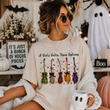 A Girl's Gotta Have Options Halloween DTF transfer with five colorful witch brooms, bows, bats, and spiderwebs