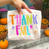 Thankful DTF Transfer, colorful bubble letter fall design on a white fabric bag, vibrant orange, purple, pink, blue, green, and yellow letters with stars and sparkles, perfect for fall and Thanksgiving celebrations.