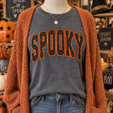 SPOOKY orange polka dot corduroy appliqué patch with black embroidered edging shown on charcoal pepper shirt