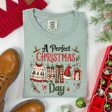 A Perfect Christmas Day DTF transfer with illustrated holiday clothesline featuring a sweater, stockings, plaid pajama pants, Santa hat, and gift box