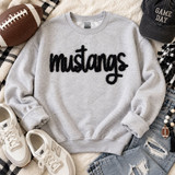 Black Mustangs script fluffy appliqué patch shown on a light gray sweatshirt.