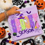 Spooky Season DTF transfer with checkered purple, pink, orange, and green lettering, witch hat, ghost, bats, and cauldron design