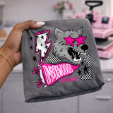 Timberwolves mascot DTF transfer with wolf head wearing pink star sunglasses, checkered accents, and a pink pennant reading "Timberwolves #PinkOut" in a bold hand-drawn school spirit style