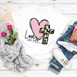 Love never fails Leopard Cross heart Corinthians Sublimation Transfer, t-shirt design featuring a pink heart and a leopard print cross with the word Love and Bible verse reference.