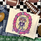 Wildcats mascot DTF transfer with gray wolf character in purple jersey and star sunglasses inside a pink and gold star frame