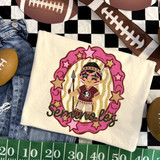 Seminoles mascot DTF transfer featuring a doll-like character in a star-glasses and glitter oval frame with pink stars, holding a spear, in a hand-painted school spirit style
