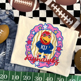 Jayhawks mascot DTF transfer featuring KU bird mascot in star sunglasses within a pink and gold star-studded frame, hand-painted school spirit style