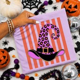 Pink leopard print witch hat DTF transfer with black brim, gold buckle, and orange striped background
