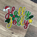Red green and gold Holly Jolly Christmas sequin patch displayed on a white holiday sweatshirt