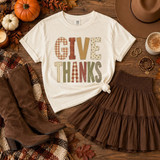 Give Thanks DTF transfer in patchwork fall fabric-style lettering with gingham, floral, and polka dot patterns