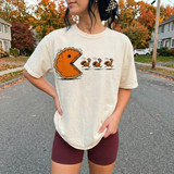 Pac-Man style pumpkin pie chasing three cartoon turkeys DTF transfer, funny Thanksgiving design