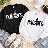 Black Raiders fluffy script patch displayed on white sweatshirt for custom mascot apparel;Black Raiders fluffy script patch displayed on white sweatshirt