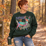 Rather Be Hunting DTF transfer with a colorful patchwork-style buck made of mixed fabric patterns, surrounded by stars and bold varsity lettering Shown on a Forest crewneck sweatshirt.