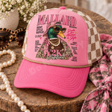 Mallard Magazine Y2K Edition DTF transfer featuring a glam mallard duck in pink camo hat, leopard sunglasses, pearls and gold chains styled as a retro magazine cover Shown on a dusty rose pink front panel with cream and tan checkered mesh back and a tan rope trucker hat.