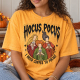 Hocus Pocus DTF transfer featuring three illustrated witch characters sipping iced coffee, framed in a circle with stars and 'I Need Coffee To Focus' lettering Shown on a Citrus t-shirt.