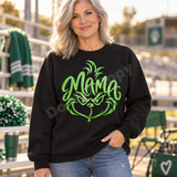 Mama DTF transfer in green glitter-style brush script shaped into a sly, whiskered face with sparkle flourish details Shown on a Black crewneck sweatshirt.