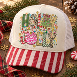 Holly Jolly Christmas DTF transfer with leopard print, plaid, and checkered lettering, Christmas lights, a pink-bowed tree, pink ornament, and gold glitter snowflakes Shown on a cream front panel, red striped bill, white mesh back trucker hat.