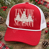 Tis the Season DTF transfer with three lace-textured ivory Christmas trees topped with lace stars over red-and-white gingham lettering Shown on a Red front panel with white rope and white mesh back trucker hat.