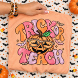 Trick or Teach Halloween DTF transfer with jack-o-lantern wearing leopard-print sunglasses, bats, and puffy bubble lettering Shown on a Peachy t-shirt.