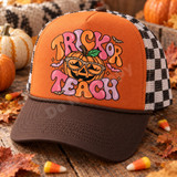Trick or Teach Halloween DTF transfer with jack-o-lantern wearing leopard-print sunglasses, bats, and puffy bubble lettering Shown on a burnt orange front panel, brown bill, black-and-white checkered mesh back trucker hat.