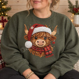 Embroidery-style highland cow Christmas DTF transfer wearing a Santa hat, plaid scarf, and ornament earring Shown on a Military Green crewneck sweatshirt.
